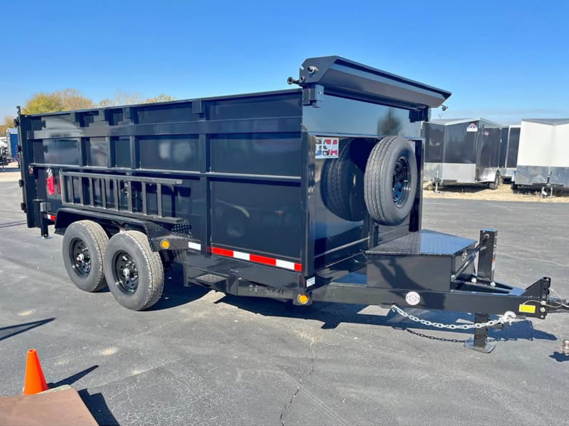 Overflowing green construction dumpster filled with cardboard boxes and building waste at urban construction site
